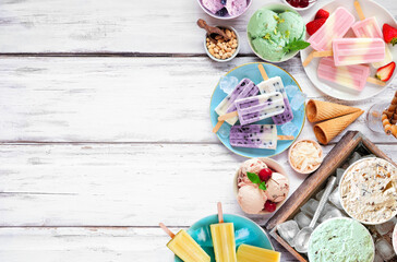 Cool summer food side border. Assorted refreshing ice cream, popsicle and frozen treats. Above view...