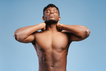 Attractive , sexy, African American man, fashion model touching neck, with closed eyes