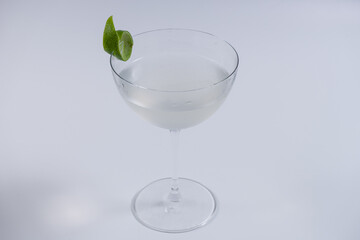refreshing gimlet cocktail in glass on white background