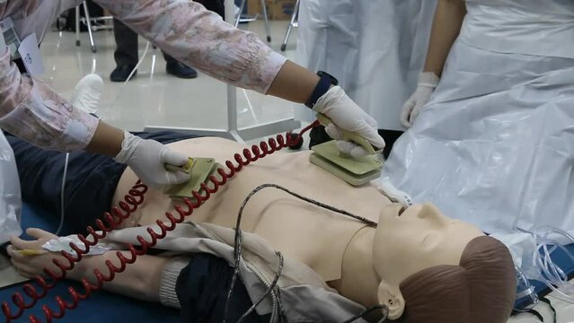 Emergency and first aid class on cpr doll, Cardiac life support