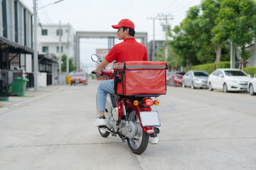 Delivery rider on motorbike in urban setting