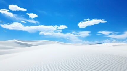 Beautiful white sand dunes on a background of the blue sky