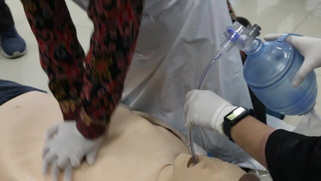 Emergency and first aid class on cpr doll, Cardiac life support