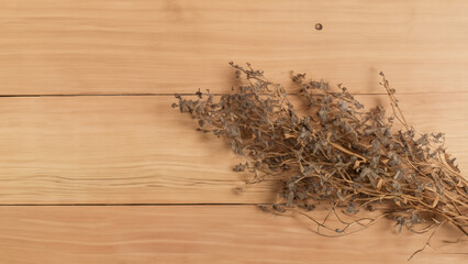 dry flower plant on the wooden table top view background for brand and design work