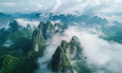 aerial view of beautiful rocky cliffs covered by the clouds. 