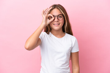 Little caucasian girl isolated on pink background With glasses with happy expression