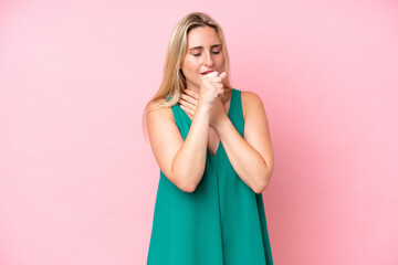 Young caucasian woman isolated on pink background coughing a lot