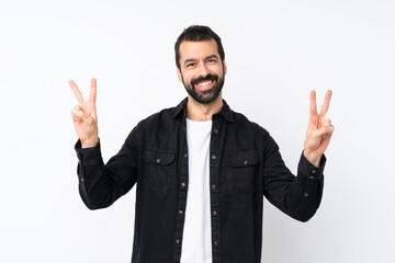 Young man with beard over isolated white background showing victory sign with both hands