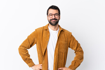 Caucasian handsome man with beard wearing a corduroy jacket over isolated white background posing...