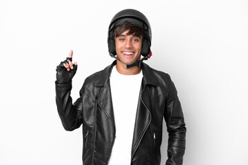Young man with a motorcycle helmet isolated on white background showing and lifting a finger in...