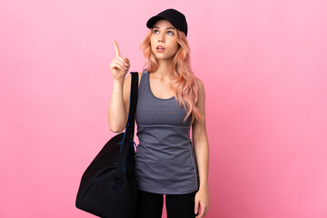 Teenager sport woman with sport bag over isolated background intending to realizes the solution...