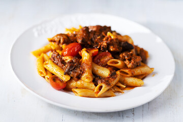 italian penne pasta in oxtail bolognese sauce