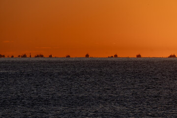 Silhouettes of a group of fishing boats at the time of departure to sea to fish for the Palamós...