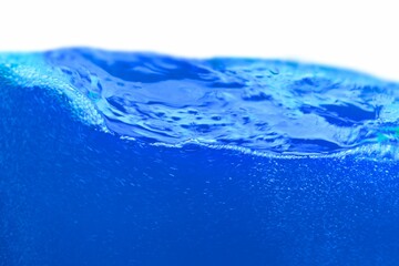 Blue water wave splash isolated on white background