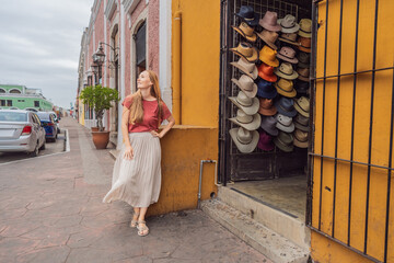 Woman tourist explores the vibrant streets of Valladolid, Mexico, immersing herself in the rich...
