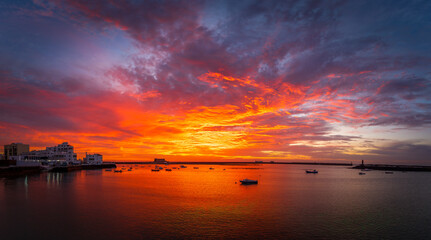 Arrecife, Lanzarote at sunset, offers a spectacular view of the harbour with moored boats and...