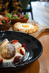 Cheese pancakes  with strawberry, Georgian khachapuri and fresh salads