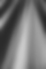 Abstract grey background. Luxury white and black of wavy texture. Concept for a scene, silver color, linen, fabric background, textiles, interior design, and wallpaper. Blurred grey fabric texture.