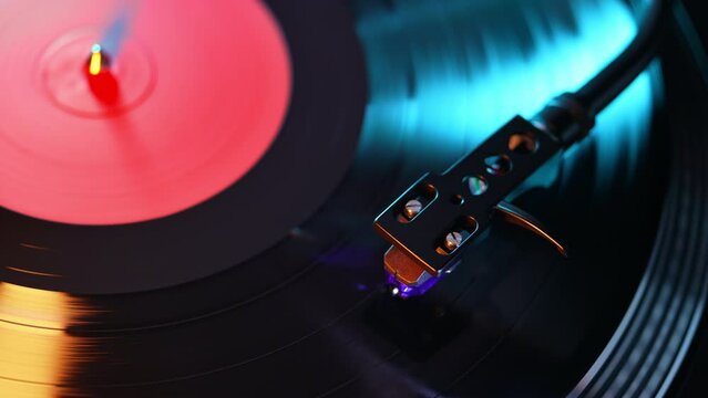 Vinyl disk DJ turntable record player. Rotating plate needle stylus, loop. Macro