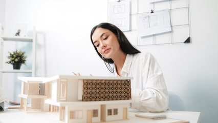 Closeup portrait image of professional young beautiful engineer architect using triangular scale...
