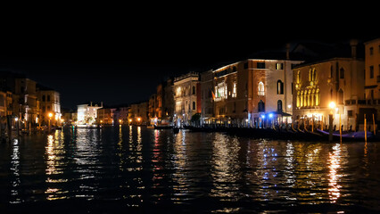 Night Venice, Italy. Canal Grande during sunset, beautiful lighting, reflection in the water,...