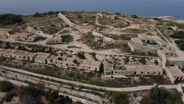 Malta, Selmun peninsula, Fort Campbell - Fortizza ta' Campbell or Il-Fortizza ta' Selmun. Aerial establishing shot on an overcast moody day. Ruins of old fortification. High quality 4k footage