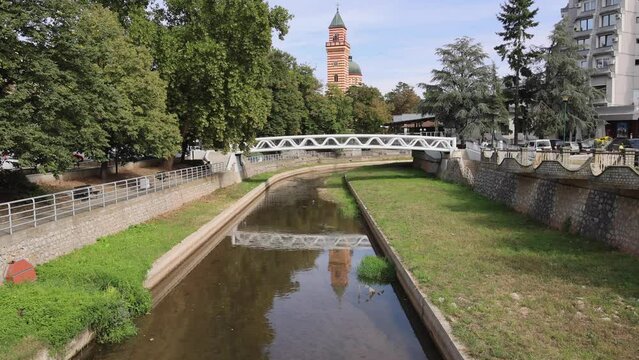 River Crnica and Old Concrete Building Petrus Hotel in Town Centre Autumn Day Paracin Serbia