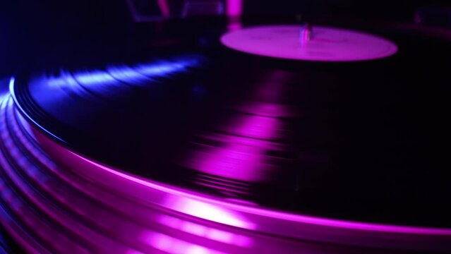 Vinyl disk DJ turntable record player. Rotating plate needle stylus, loop. Macro