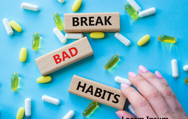 Break bad habits symbol. Concept words Break bad habits on wooden blocks. Beautiful blue background...