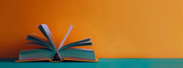 Stack of Books on Orange Background
