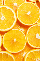 Slices of juicy orange as background, top view