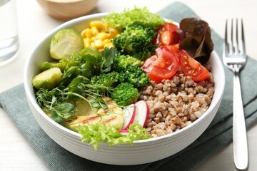 Healthy meal. Tasty products in bowl on white table, closeup