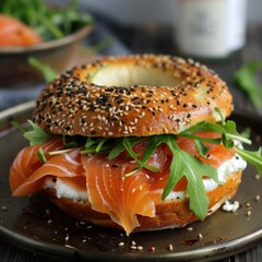Smoked salmon and cream cheese bagel with arugula.