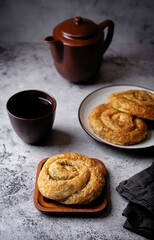 Spiral filo dough Greek pie with filling in a plate