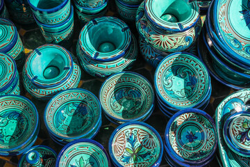 Morrocan turquoise pottery, ceramics in small traditional soukh shop of Marrakech, full frame,...