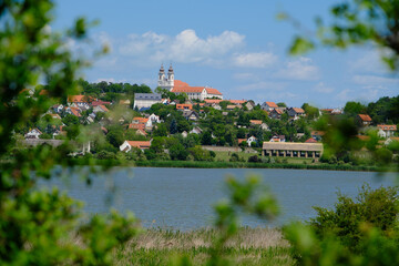 Tihany Abbey tourisctic attraction with the inner lake and framed by foliage near to Lake Balaton...