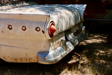 old rusty car in a desert junkyard