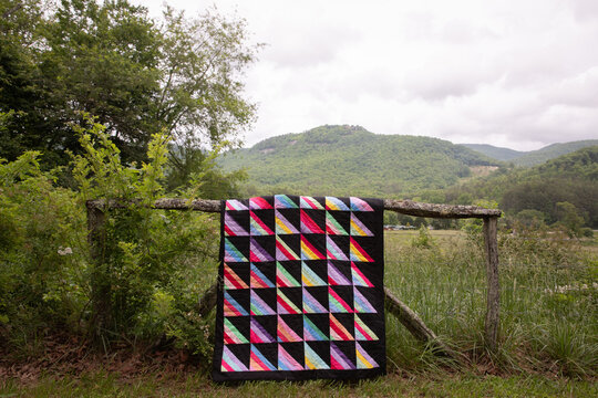 quilt on fence in mountains