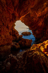 Sunset View Through Coastal Cave