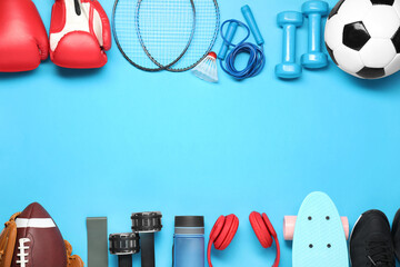 Different sports equipment on light blue background, flat lay. Space for text