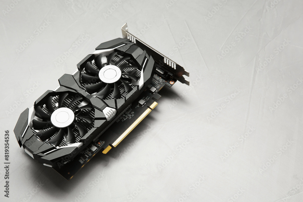 Fototapete computer graphics card on gray textured background, space for text