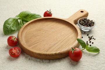 Cutting board, basil, spices and tomatoes on white textured table. Space for text