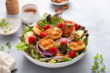 Fresh goat cheese salad with mixed greens and berries