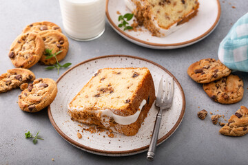 Glazed bundt cake with cookie crumbles on kitchen counter
