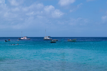 View of boats saliling in the caribbean sea seen from Cas Abao beach, Curacao