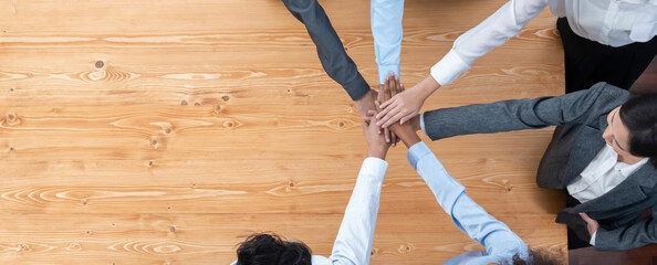 Top view panoramic banner hand stack by office worker show solidarity teamwork and trust in...