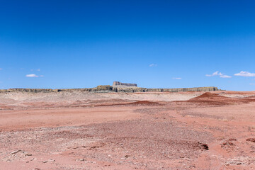 Desert landscape with Factory Butte in the background.