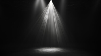 Black background illuminated by a single, powerful spotlight in the center