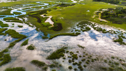 Southern aerial marsh views with reflection of sky