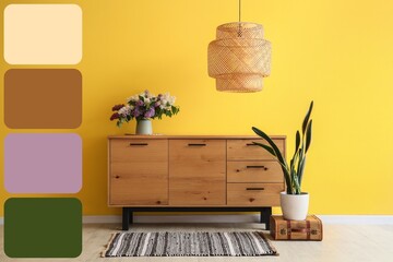 Vase with flowers on wooden cabinet, lamp and houseplant near yellow wall in room. Different color patterns